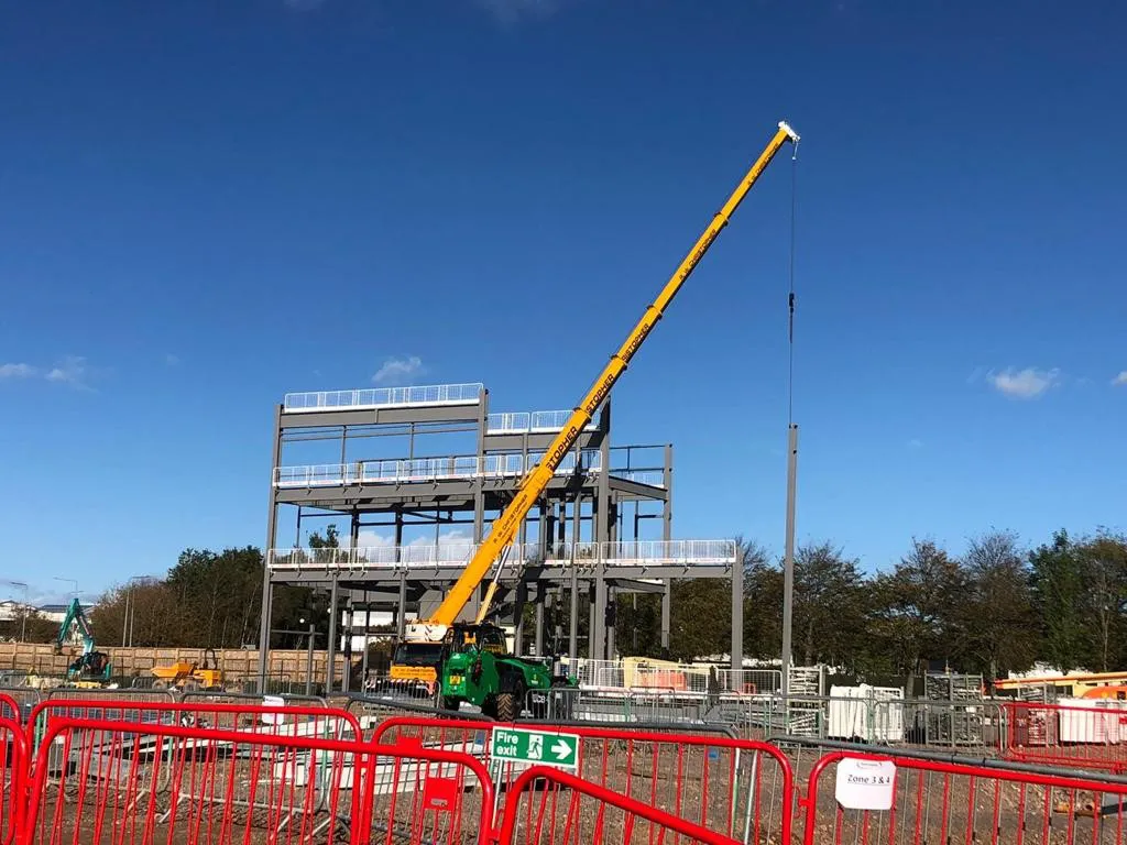 Using a crane to erect a steel structure